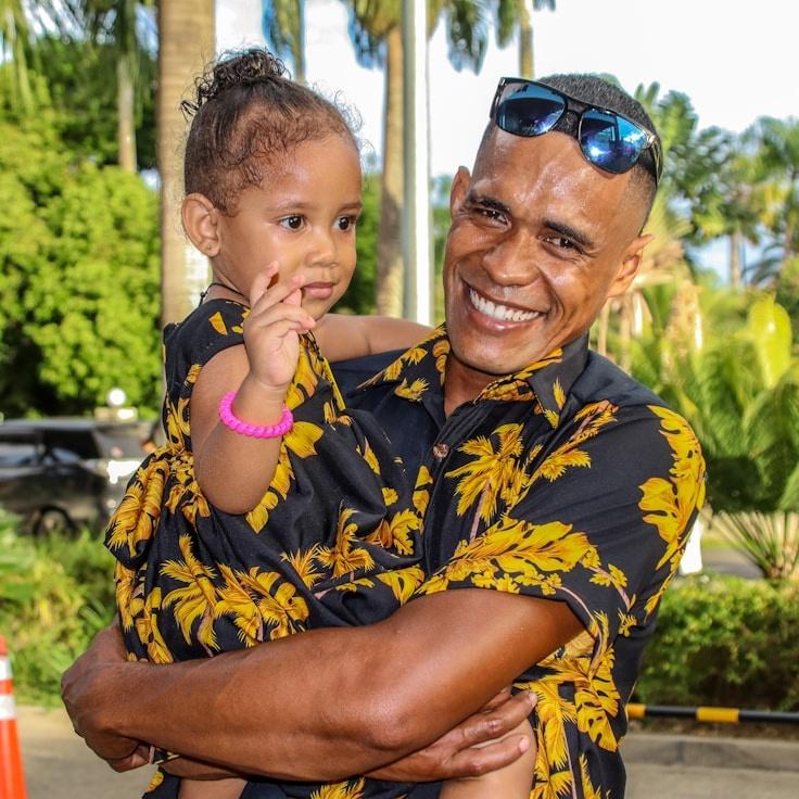 Kaveri Mehta, Lead Design Curator at Green Atlas Forge, reviewing corporate floral arrangements